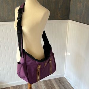 This is a purple colored pet gear brand pet carrier.